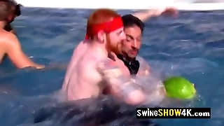 A torrid group of swingers is having fun carrying-on naked in the water.